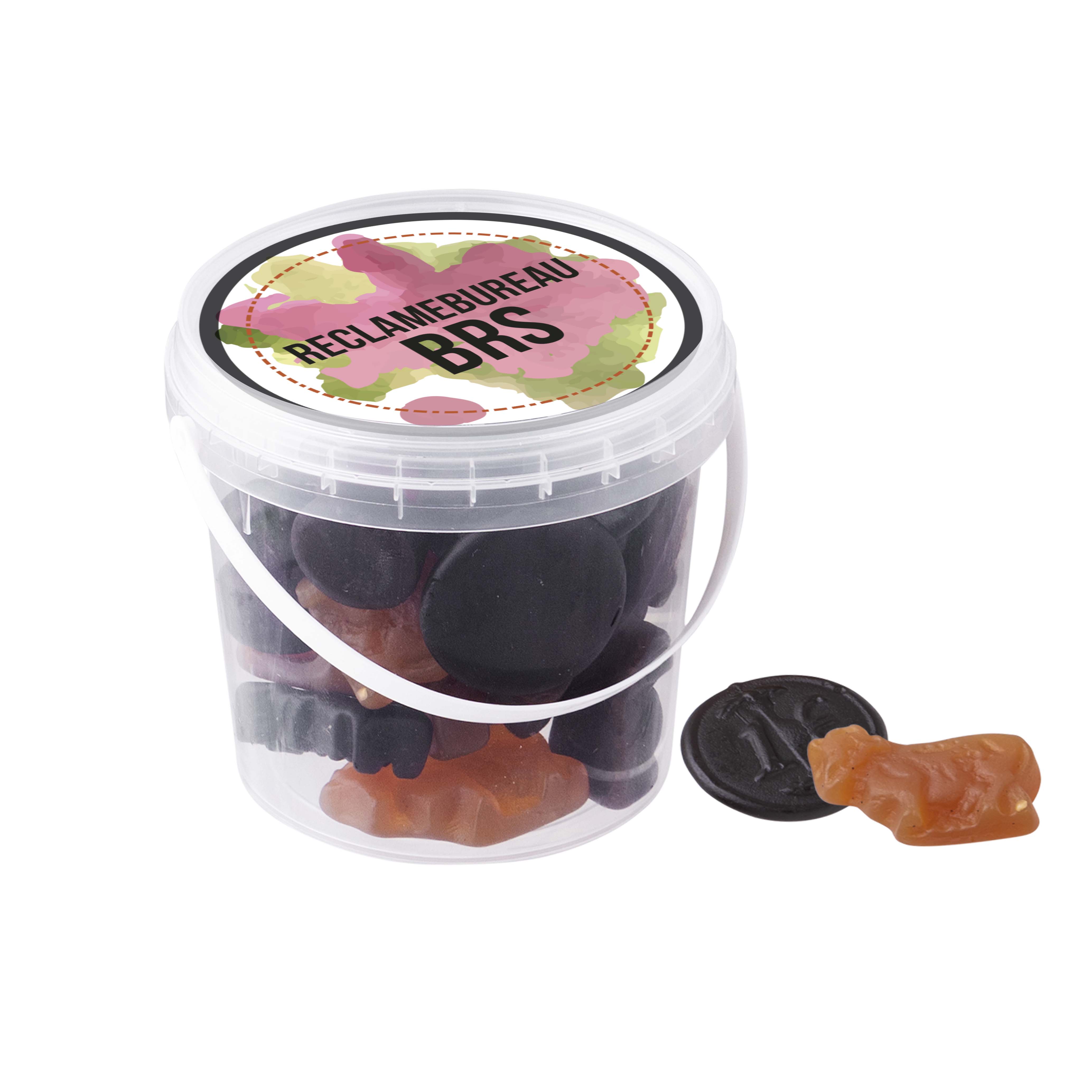 Petit seau avec des sucettes à la réglisse ou des bonbons gélifiés